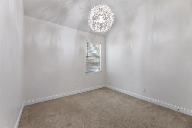 a kitchen with granite countertop stainless steel appliances a stove a sink and a microwave