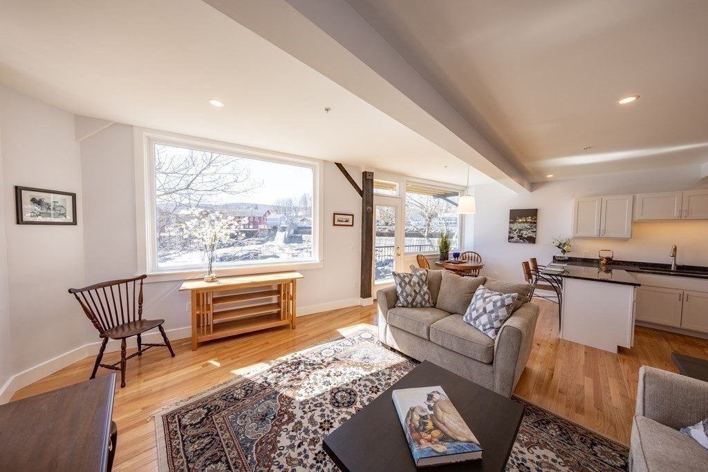 10 Deerfield Avenue, Unit 5 Shelburne, MA 01370 - Photo 1 of 28 a living room with furniture and a large window