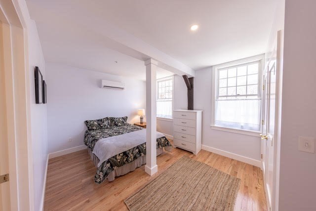 10 Deerfield Avenue, Unit 5 Shelburne, MA 01370 - Photo 15 of 28 a bedroom with furniture and a window