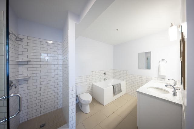 10 Deerfield Avenue, Unit 5 Shelburne, MA 01370 - Photo 16 of 28 a bathroom with a sink a toilet and shower