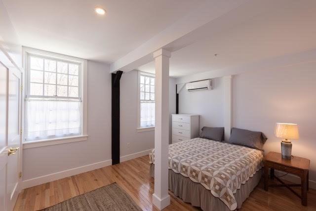 10 Deerfield Avenue, Unit 5 Shelburne, MA 01370 - Photo 18 of 28 a bedroom with a bed and a window