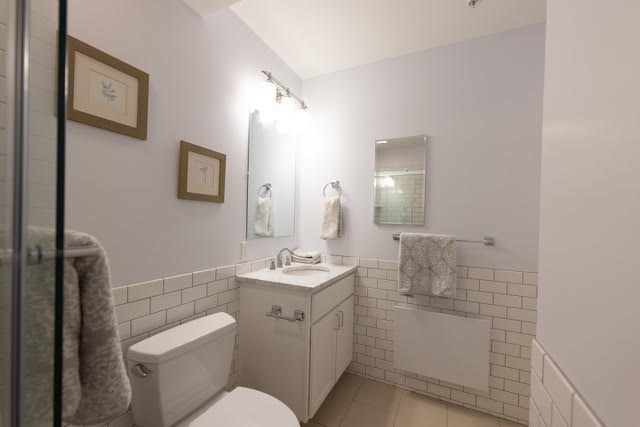 10 Deerfield Avenue, Unit 5 Shelburne, MA 01370 - Photo 19 of 28 a bathroom with a toilet sink and mirror