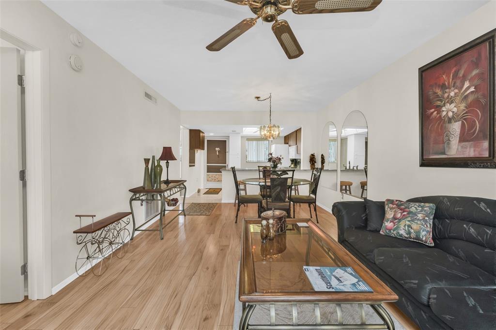 25225 Rampart Boulevard, Unit 1604 Punta Gorda, FL 33983 - Photo 11 of 41 a living room with furniture and wooden floor
