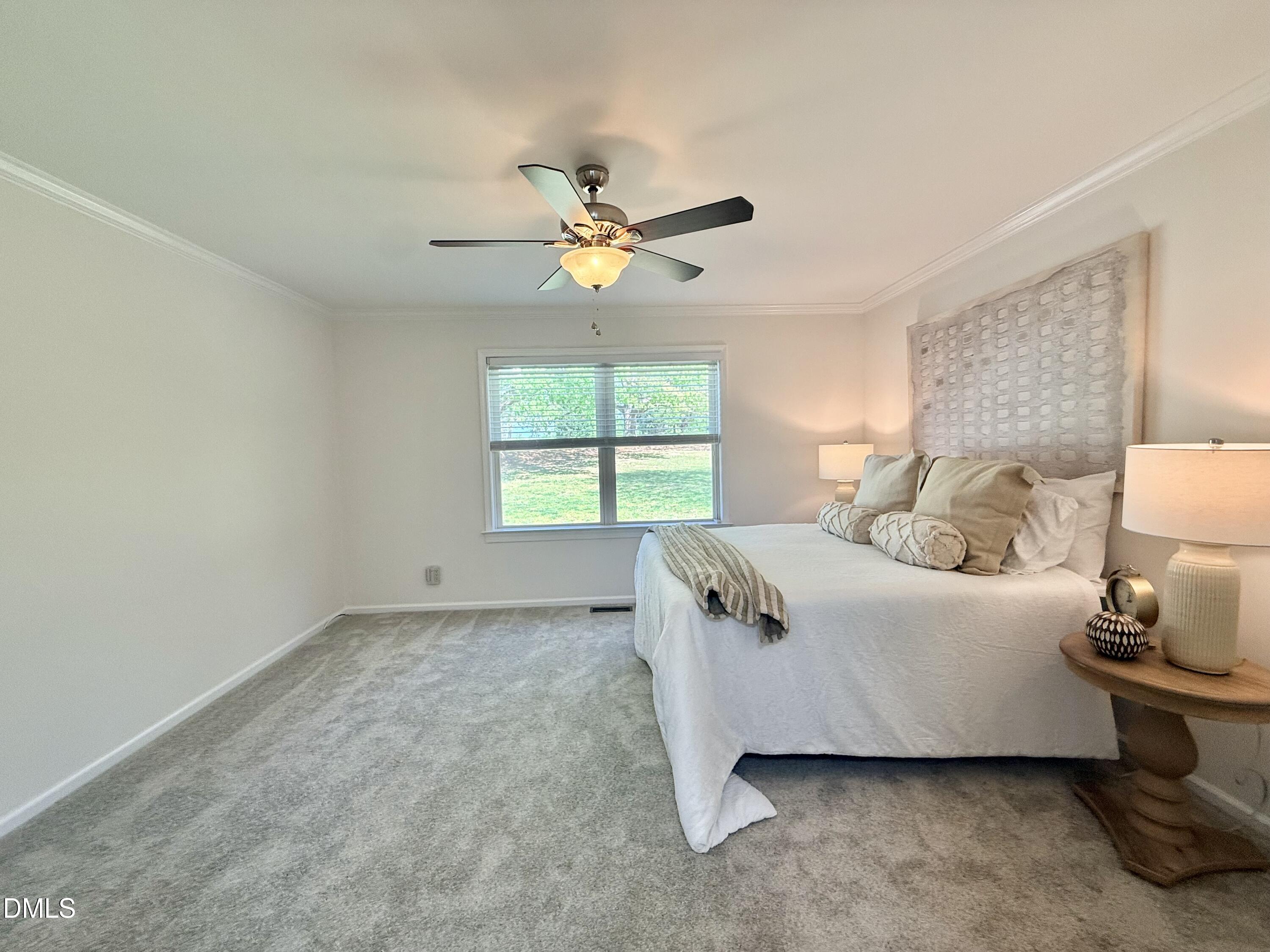 2429 Halifax Road Roxboro, NC 27573 - Photo 28 of 54 a bedroom with a bed and a window