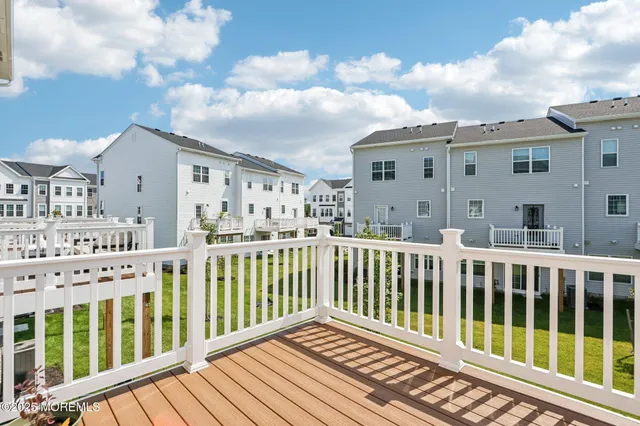 a view of a house with wooden deck