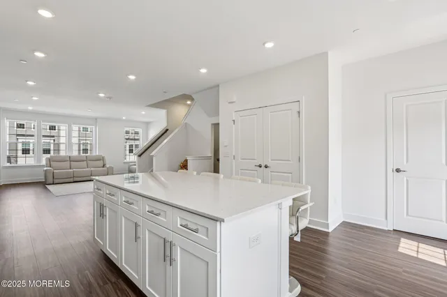 a kitchen that has a lot of cabinets in it