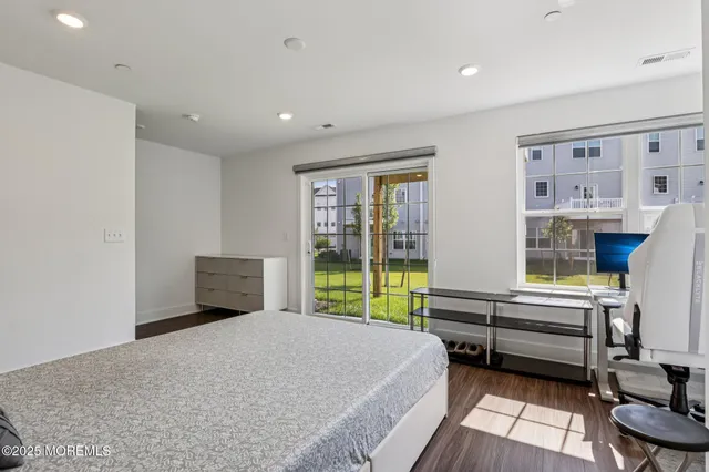 a bed room with a bed and a window