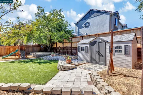 a view of a backyard with sitting area