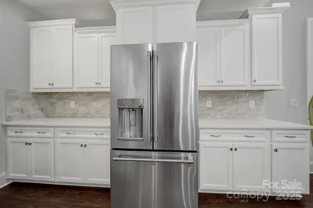a kitchen with appliances and cabinets