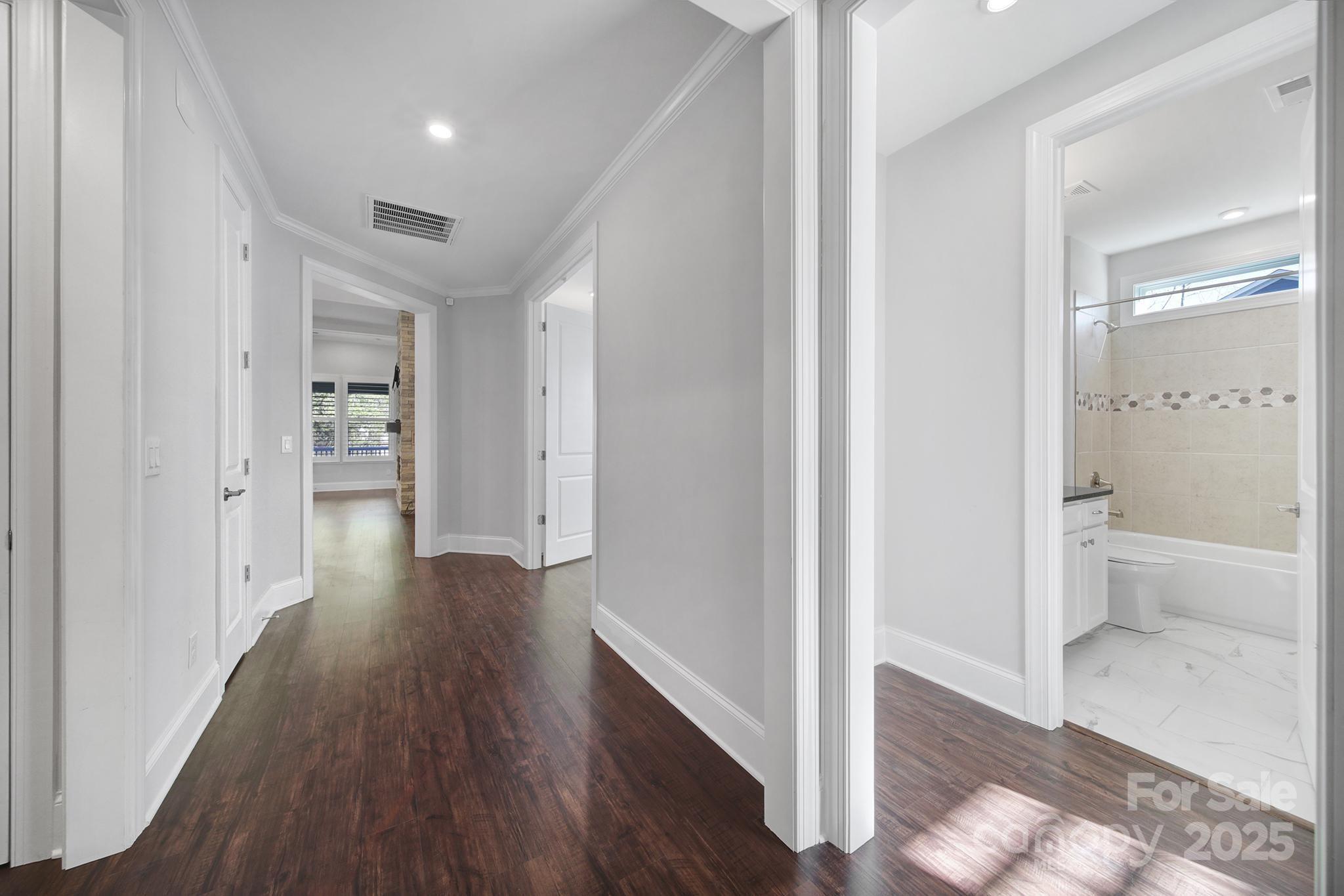3509 Aqua Point Drive York, SC 29745 - Photo 2 of 48 a view of a hallway with wooden floor and a bathroom