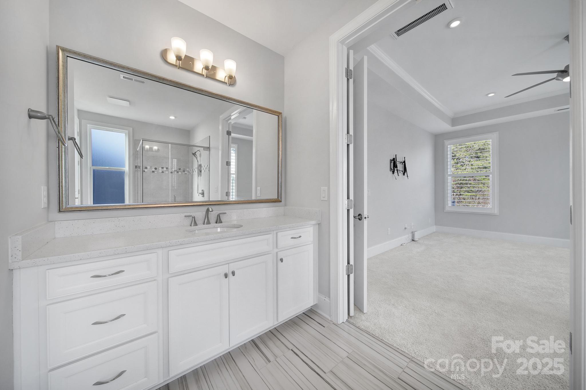 3509 Aqua Point Drive York, SC 29745 - Photo 23 of 48 a spacious bathroom with a granite countertop sink a mirror and a