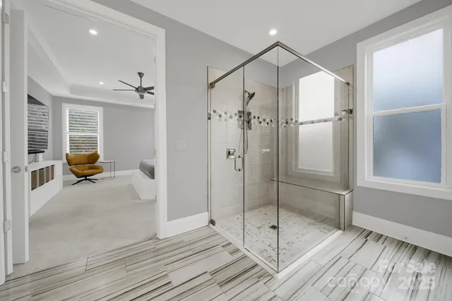 a bathroom with a shower and a sink