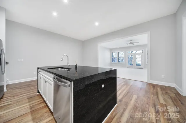an aerial view of house with yard swimming pool and outdoor seating