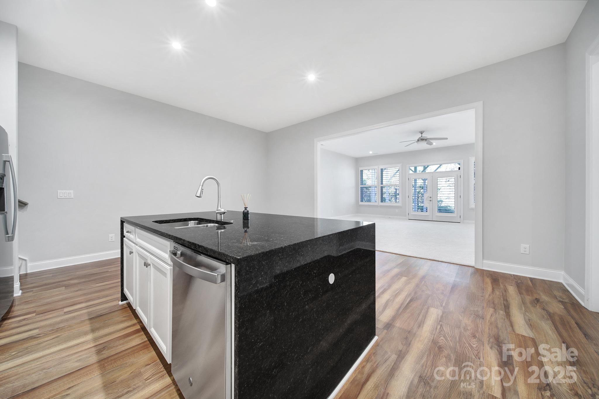 3509 Aqua Point Drive York, SC 29745 - Photo 27 of 48 a kitchen with a sink and wooden floor
