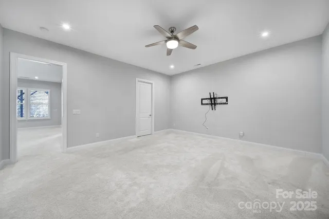 a view of a park that has large trees