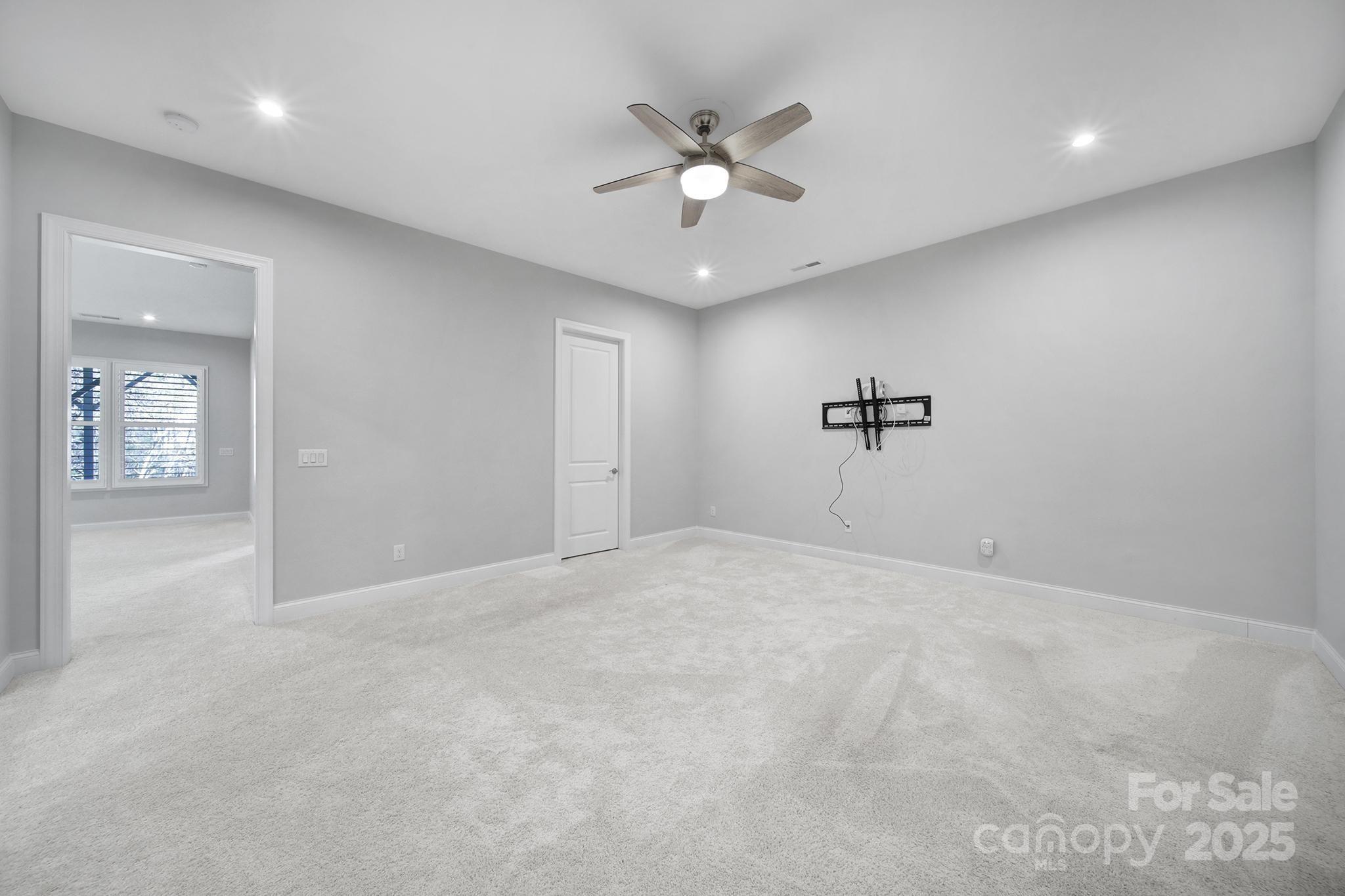 3509 Aqua Point Drive York, SC 29745 - Photo 28 of 48 wooden floor in an empty room with a ceiling fan