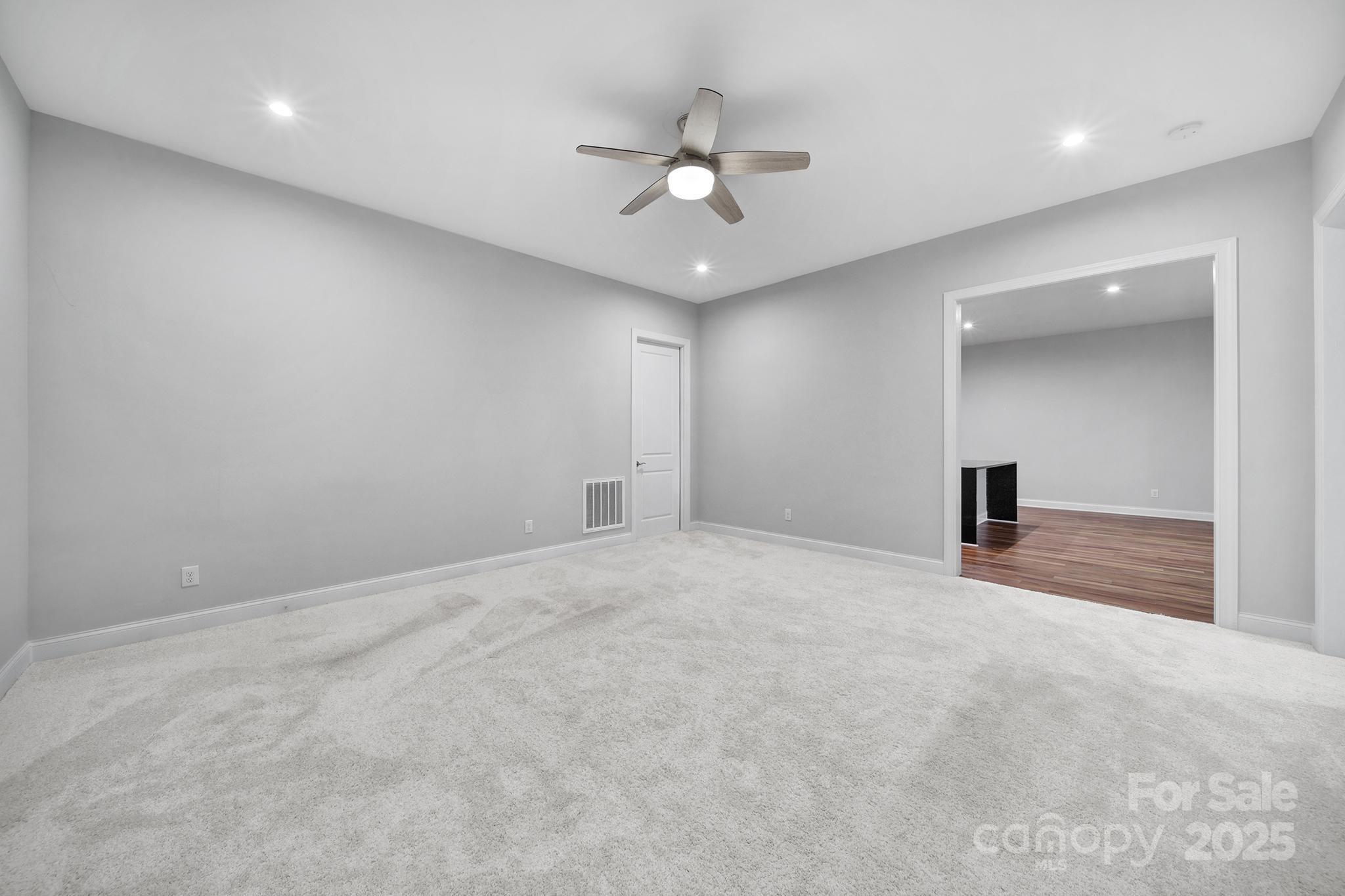 3509 Aqua Point Drive York, SC 29745 - Photo 29 of 48 a view of an empty room with a ceiling fan