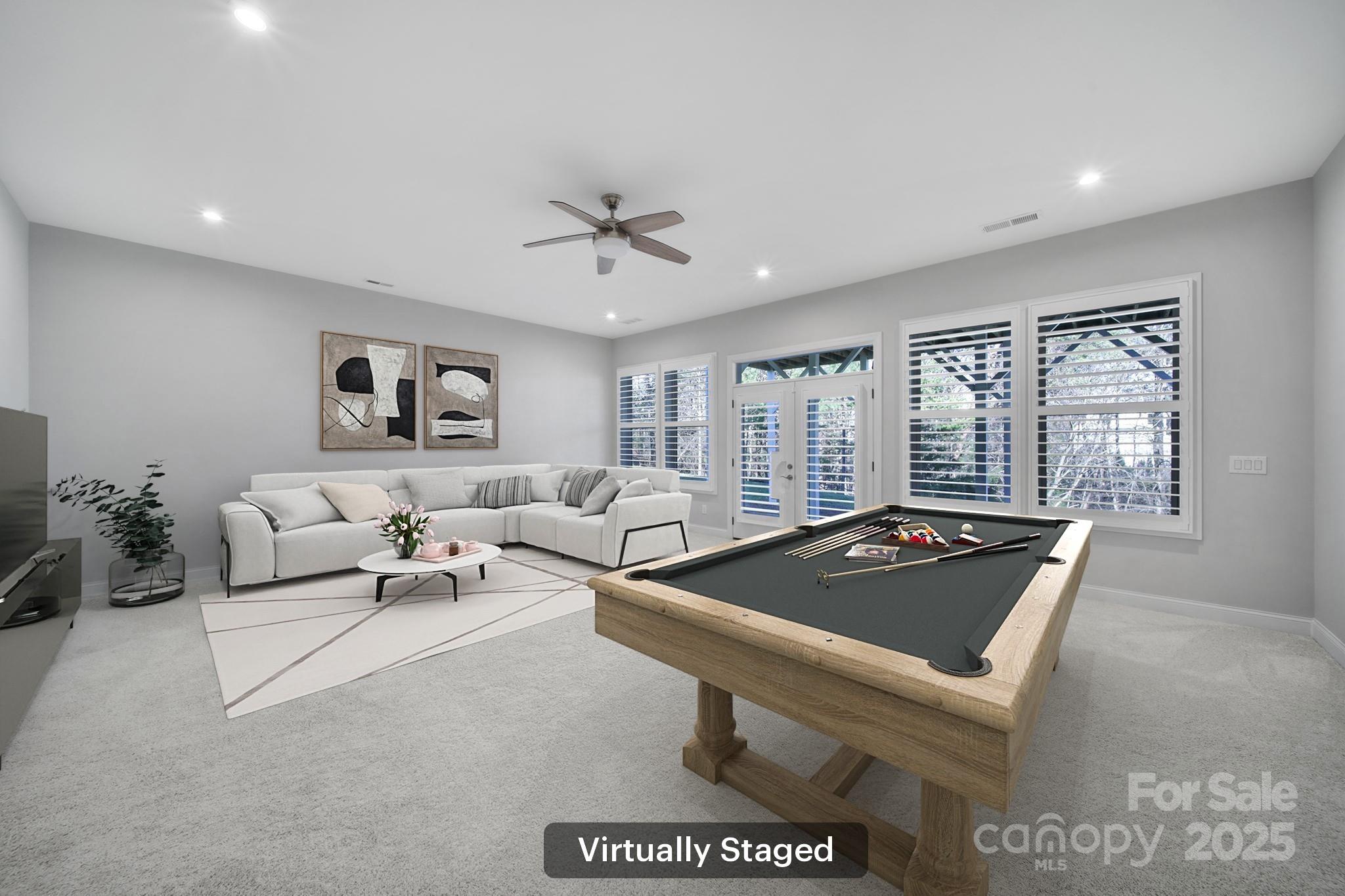 3509 Aqua Point Drive York, SC 29745 - Photo 30 of 48 a living room with furniture a chandelier and a window
