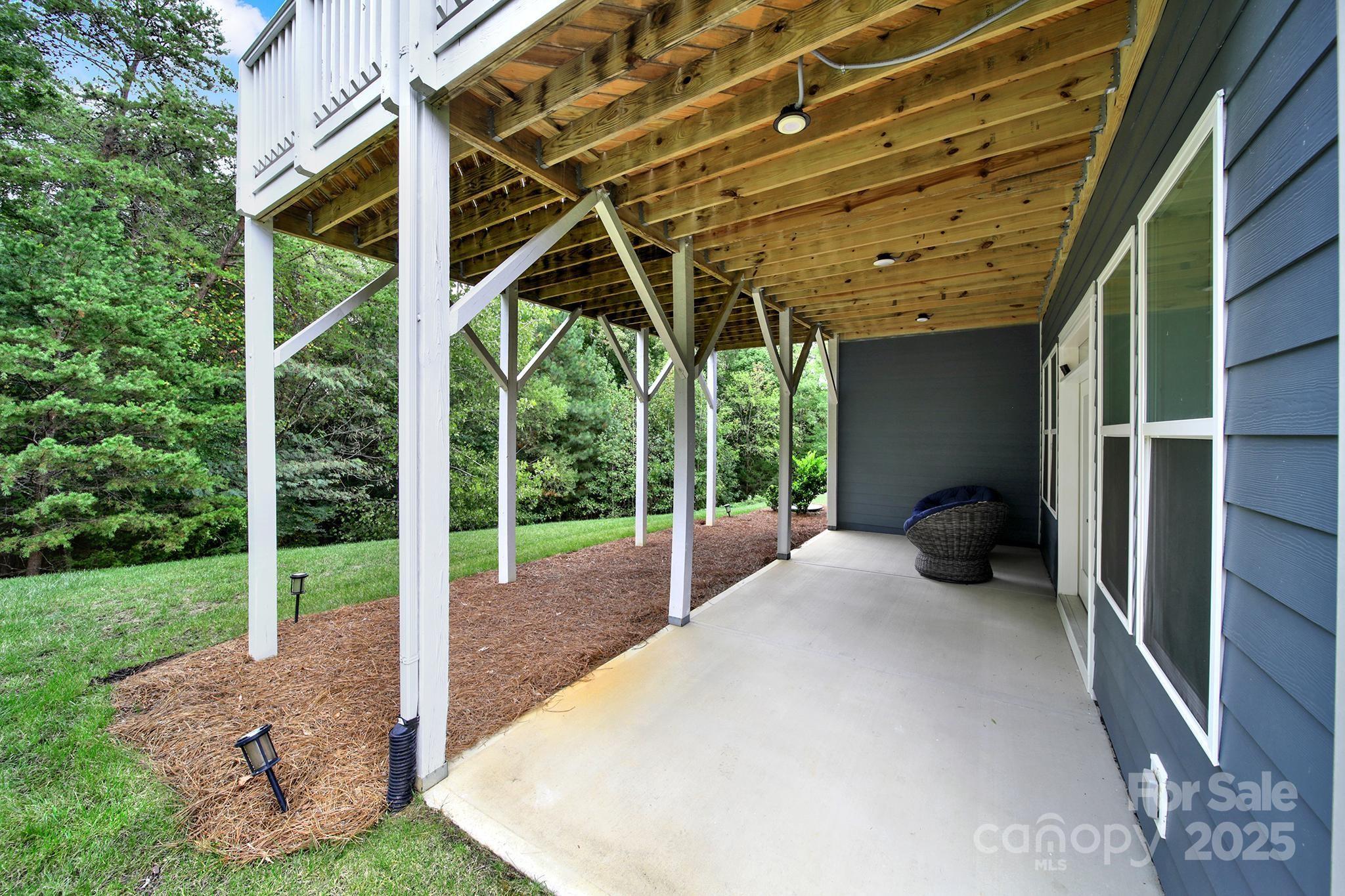 3509 Aqua Point Drive York, SC 29745 - Photo 40 of 48 a view of a porch with furniture and a backyard