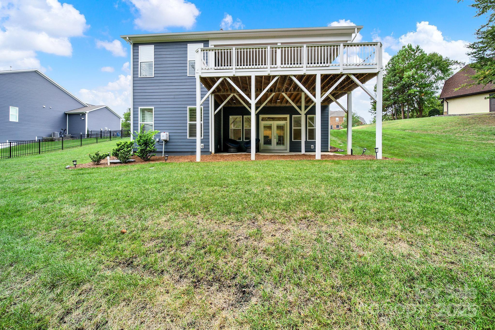 3509 Aqua Point Drive York, SC 29745 - Photo 41 of 48 a view of a house with backyard and a tree