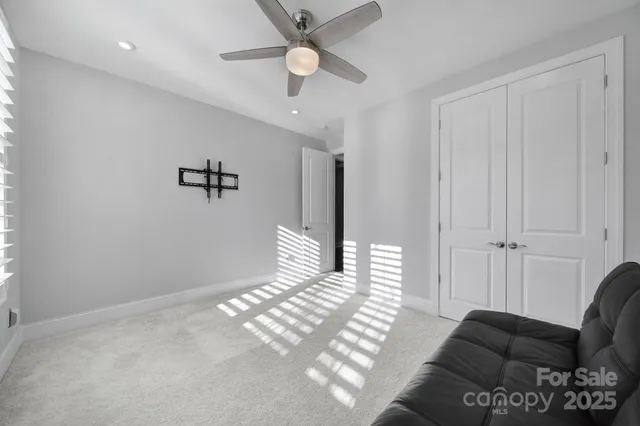 a spacious bathroom with a double vanity sink a mirror and a shower