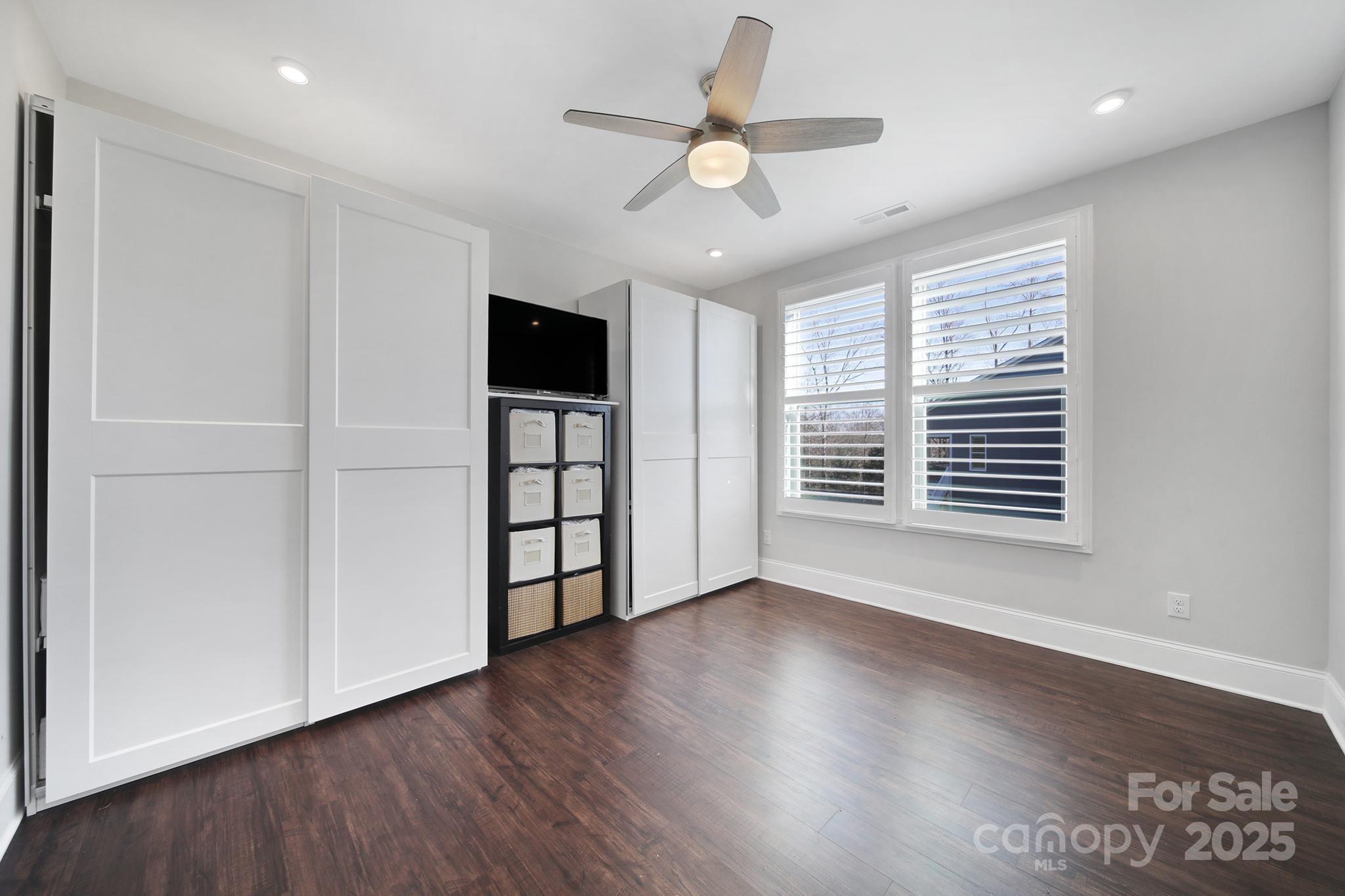 3509 Aqua Point Drive York, SC 29745 - Photo 7 of 48 a view of an empty room with a window and wooden floor