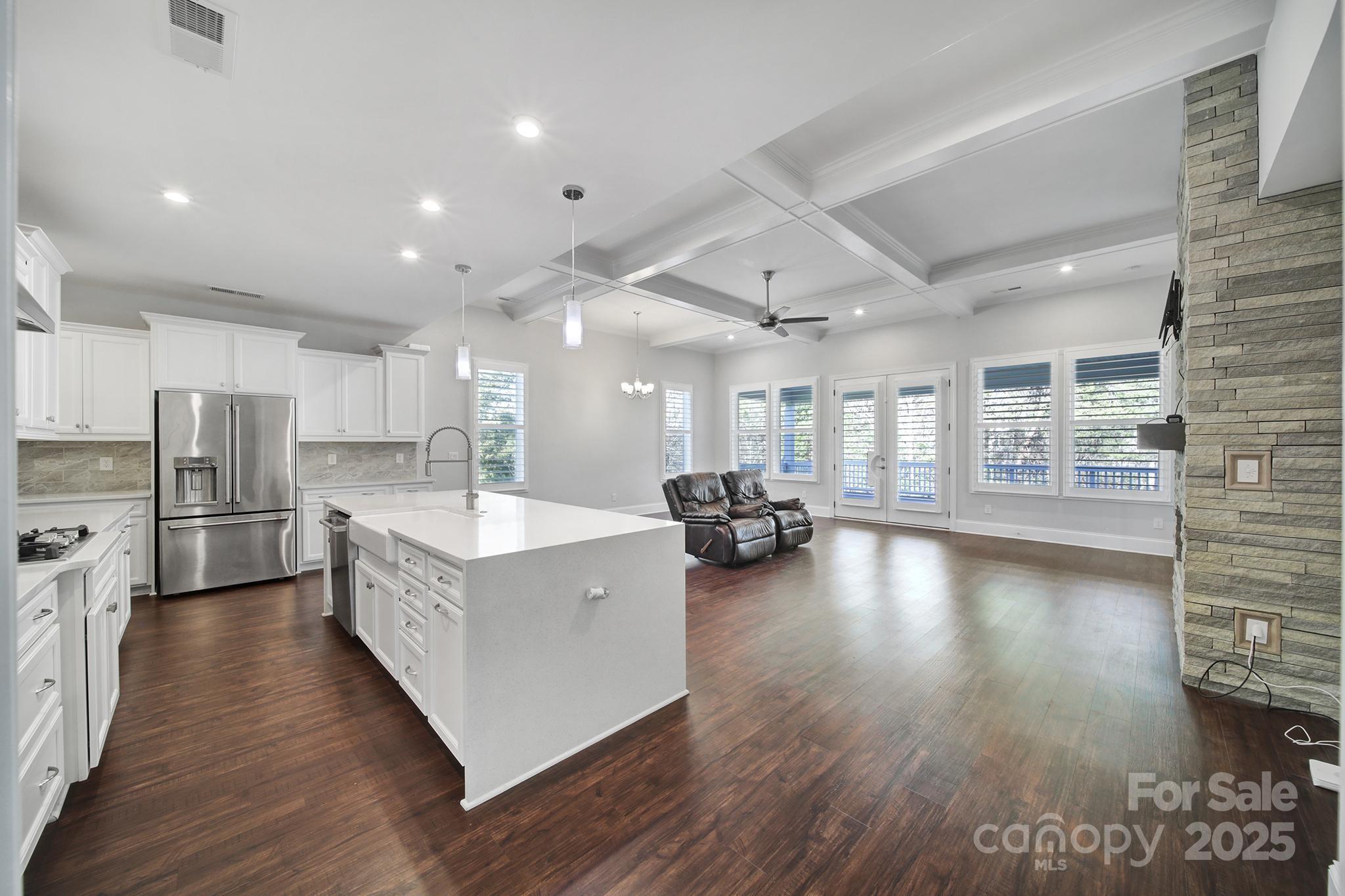 3509 Aqua Point Drive York, SC 29745 - Photo 9 of 48 a large kitchen with stainless steel appliances kitchen island granite countertop a large cabinets a sink and wooden floor