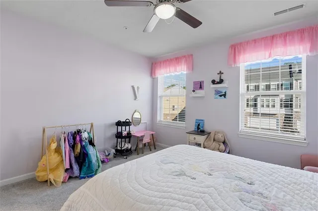 a bed room with a bed and a window