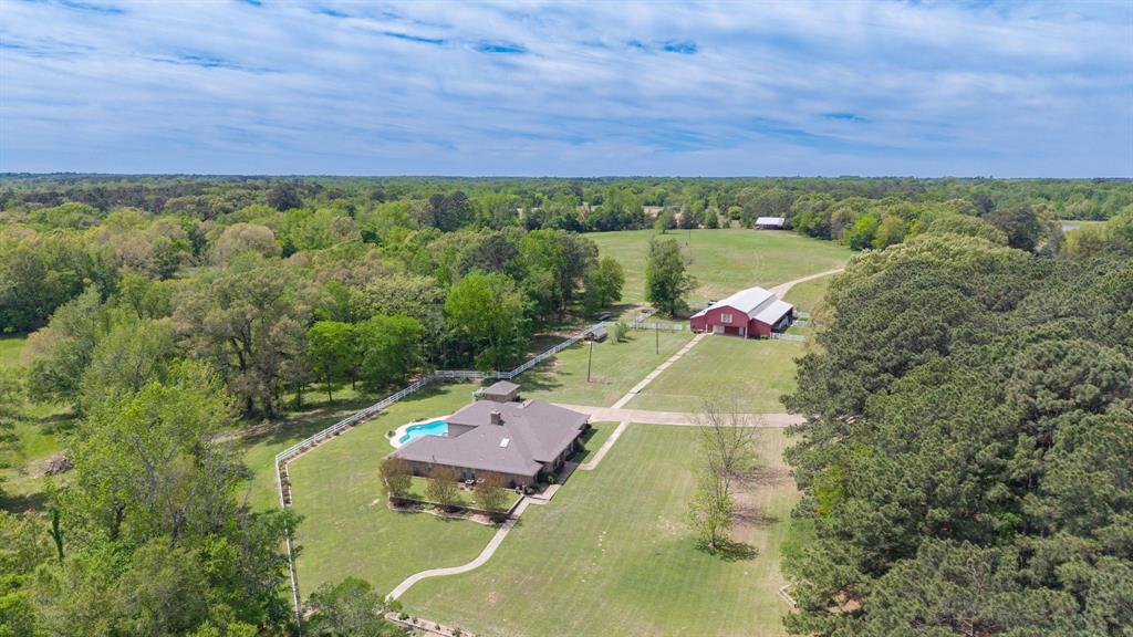 166 County Road 2112 Pittsburg, TX 75686 - Photo 1 of 40 an aerial view of a house with a yard
