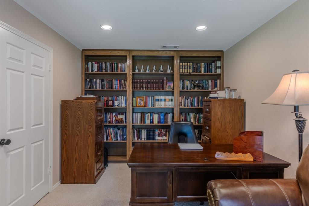 166 County Road 2112 Pittsburg, TX 75686 - Photo 15 of 40 a room with furniture and a book shelf