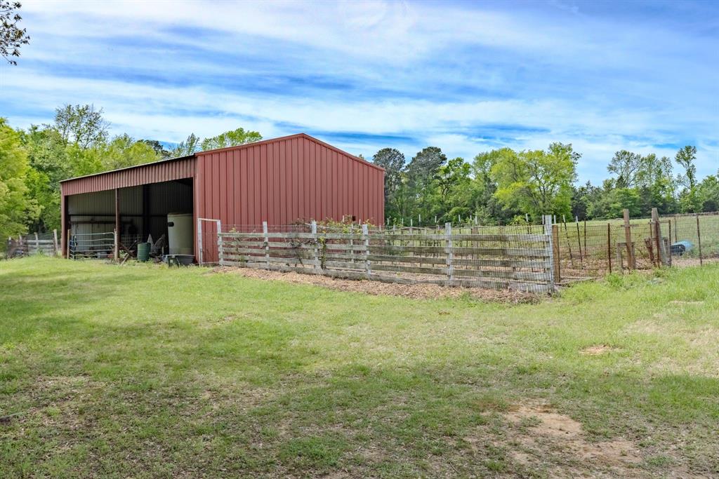 166 County Road 2112 Pittsburg, TX 75686 - Photo 24 of 40 a view of a house with a yard