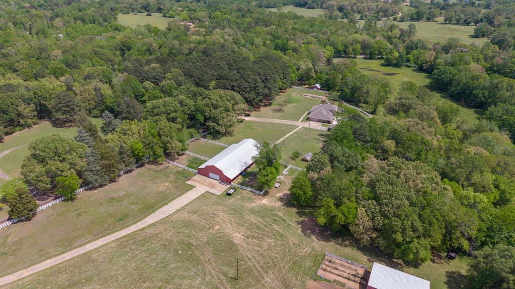 166 County Road 2112 Pittsburg, TX 75686 - Photo 25 of 40 an aerial view of a house with a yard