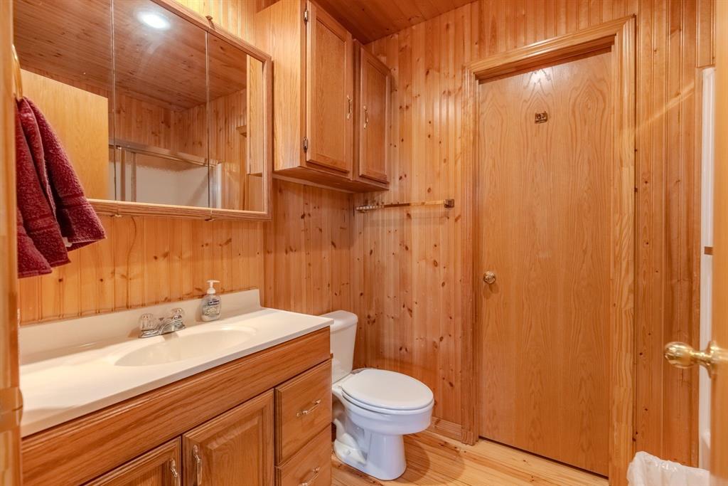 166 County Road 2112 Pittsburg, TX 75686 - Photo 31 of 40 a bathroom with a sink a toilet and shower