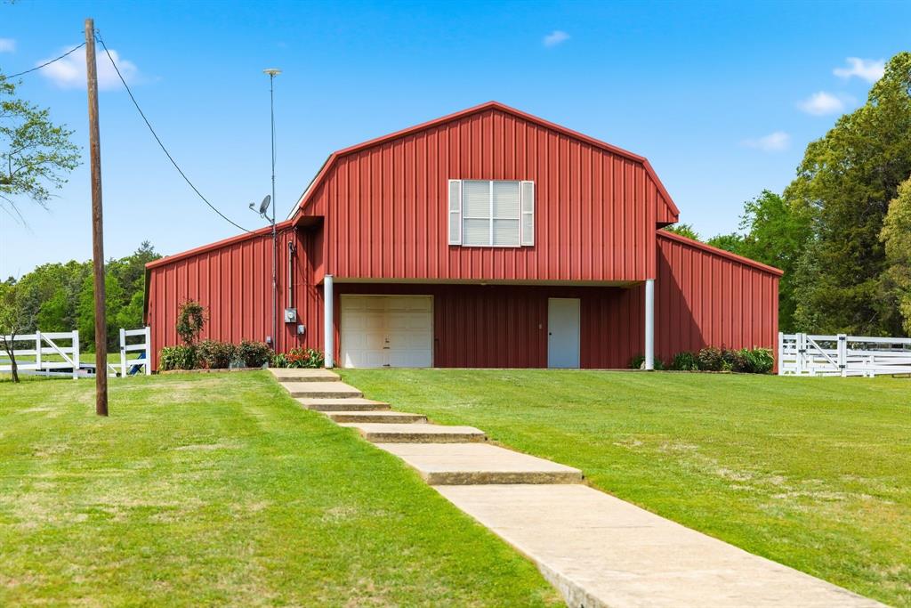 166 County Road 2112 Pittsburg, TX 75686 - Photo 4 of 40 a view of a house with backyard