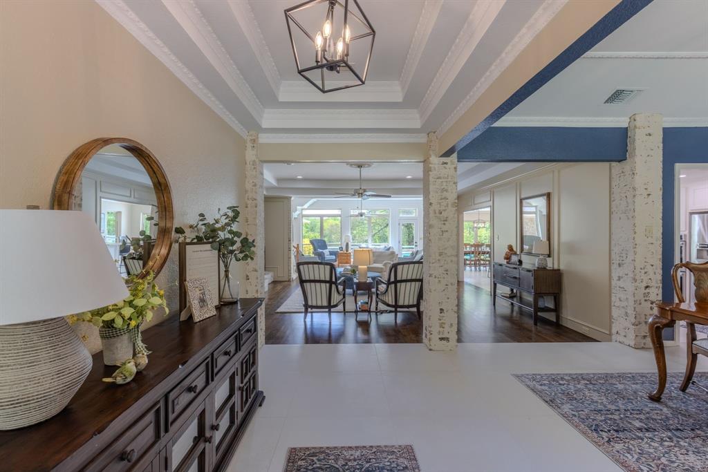 166 County Road 2112 Pittsburg, TX 75686 - Photo 8 of 40 a dining room with furniture kitchen view and wooden floor