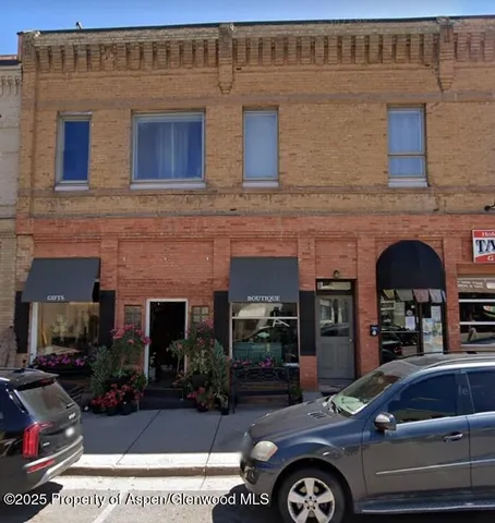a car parked in front of a building