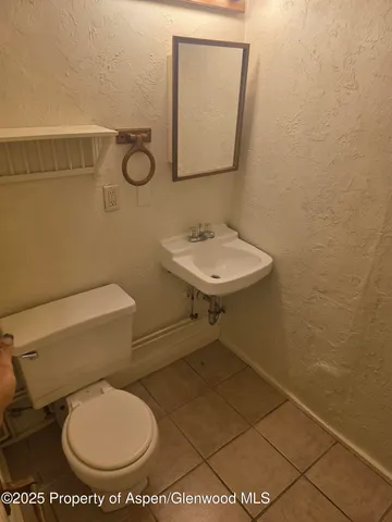 a bathroom with a toilet and a sink