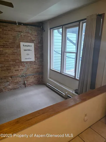 a view of an empty room and window