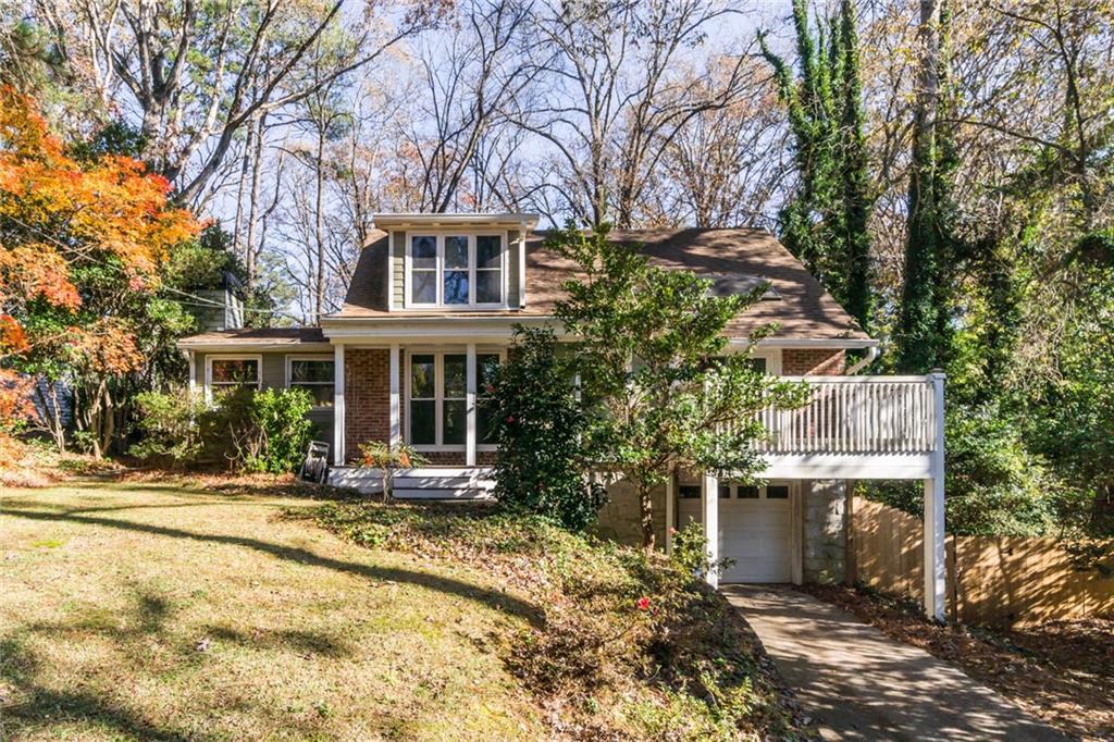 2715 Ridgemore Road Northwest Atlanta, GA 30318 - Photo 1 of 1 a front view of a house with a yard