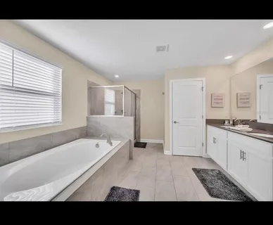 a bathroom with a bathtub and a sink