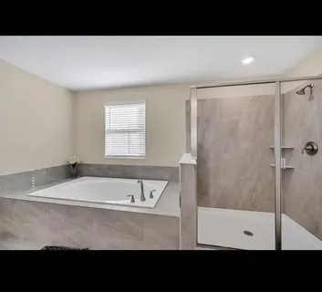 a bathroom with a bathtub and a sink