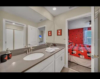 a bathroom with a sink double vanity and a mirror