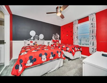 a bedroom with bed and window