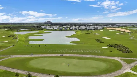 a view of a swimming pool and an outdoor seating