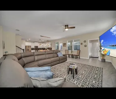 a living room with furniture and a couch