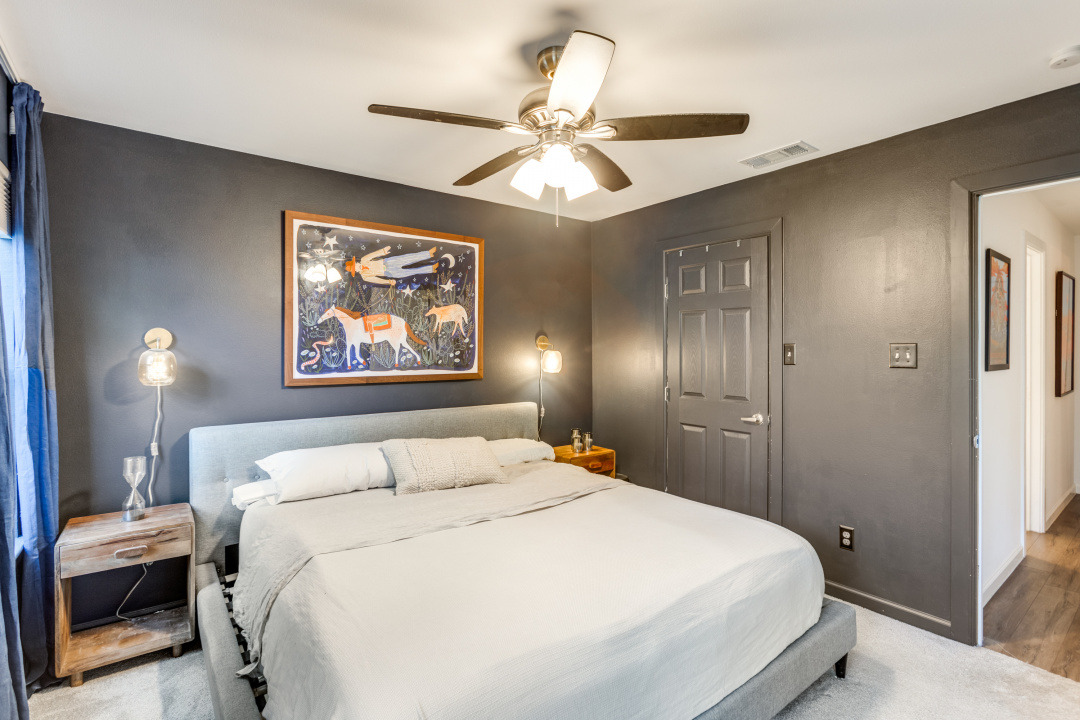 3604 Clawson Road, Unit 202 Austin, TX 78704 - Photo 14 of 23 a bedroom with a bed and a chandelier