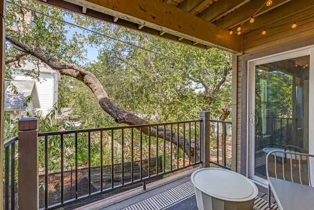 a view of a balcony and mountain with wooden floor