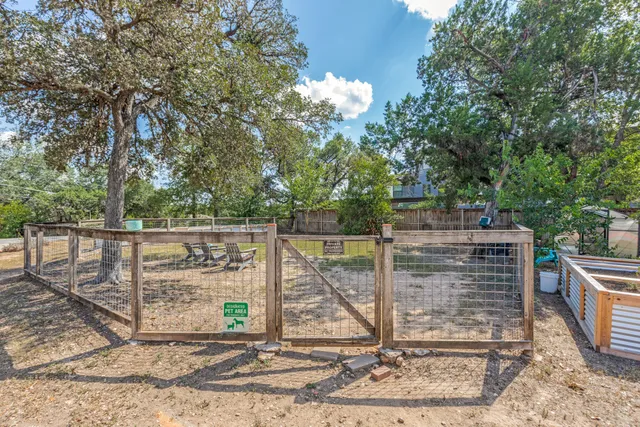 a view of yard with swimming pool and trees