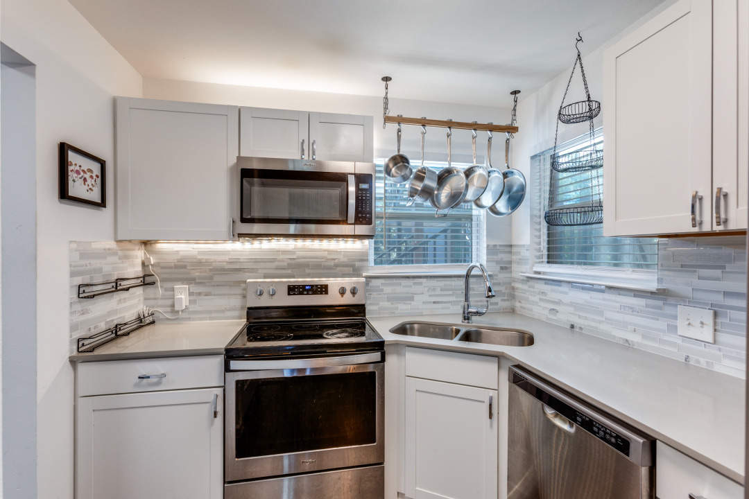 3604 Clawson Road, Unit 202 Austin, TX 78704 - Photo 7 of 23 a kitchen with a sink stove and microwave