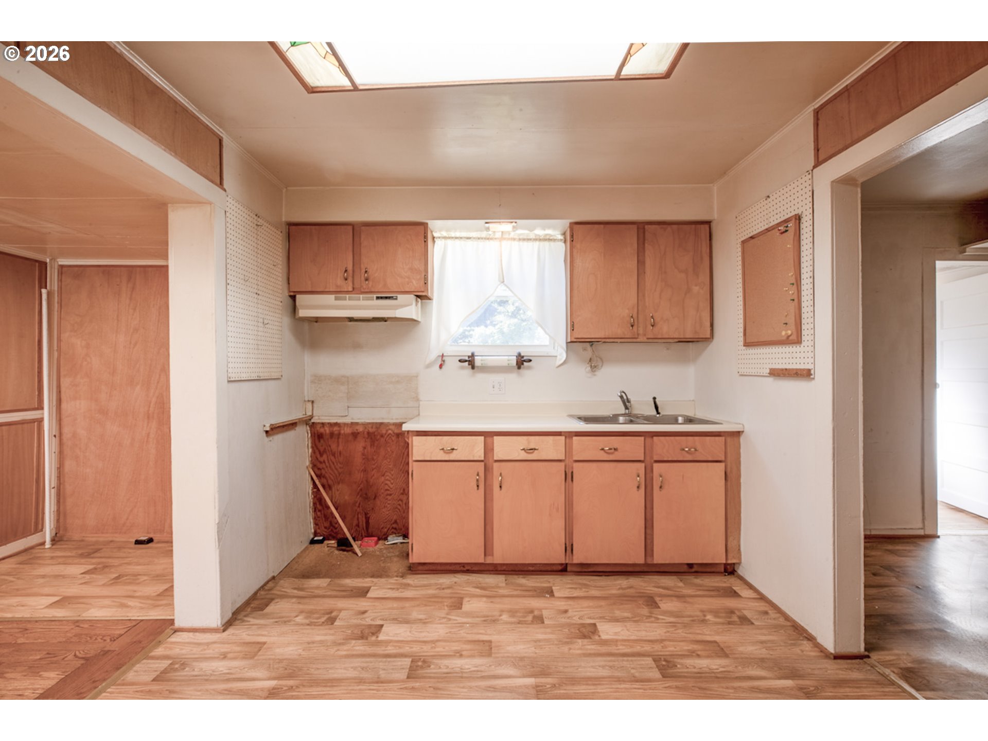 47433 School Street Oakridge, OR 97463 - Photo 5 of 16 a kitchen with stainless steel appliances granite countertop a sink and a refrigerator